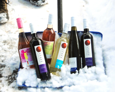 Photo of six bottles of wine in a snow shovel